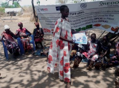 Sadia John a leader of mother to mother’s support groups in Ngapul giving lesson exclusive breastfeeding and complementary feeding (Courtesy photo by Obwoya Juma-Nutrition Manager)