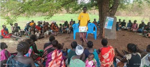Yayo Kelega Allan a beneficiary of the MIYCN component of the project sharing key MIYCN messages with other beneficiaries (Courtesy photo by Logocho Allan MIYCN counsellor in Ngapul site)